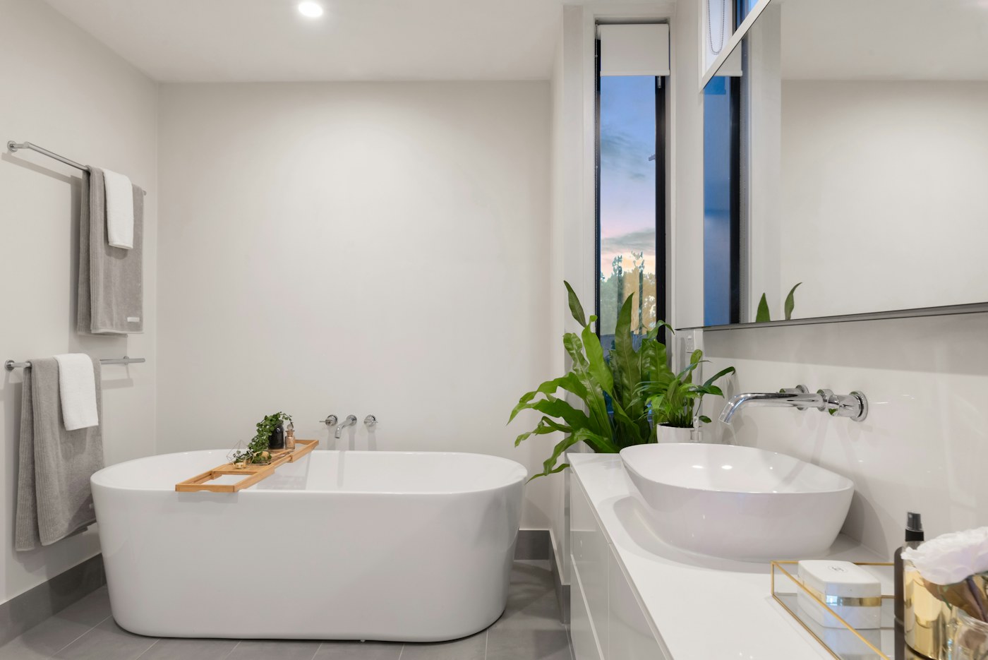 Soft bath towels stacked in a bright bathroom