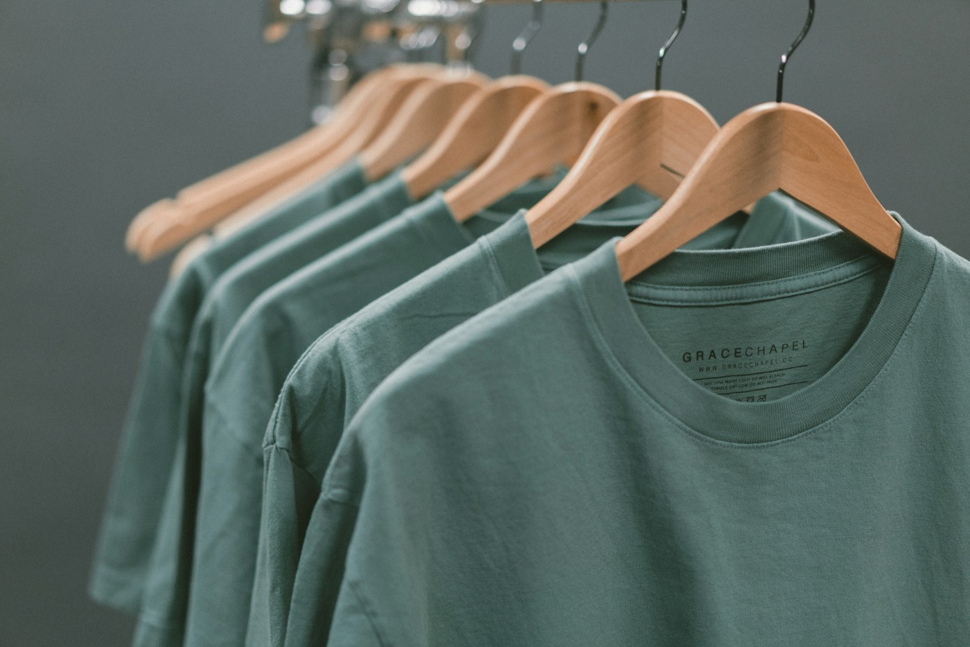 Organized closet with neutral and warm-toned clothing